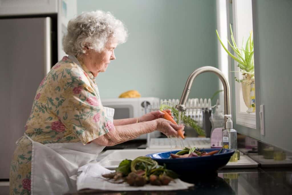 Senior Lady washing dishes