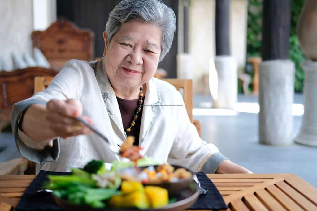 Senior woman eating healthy food