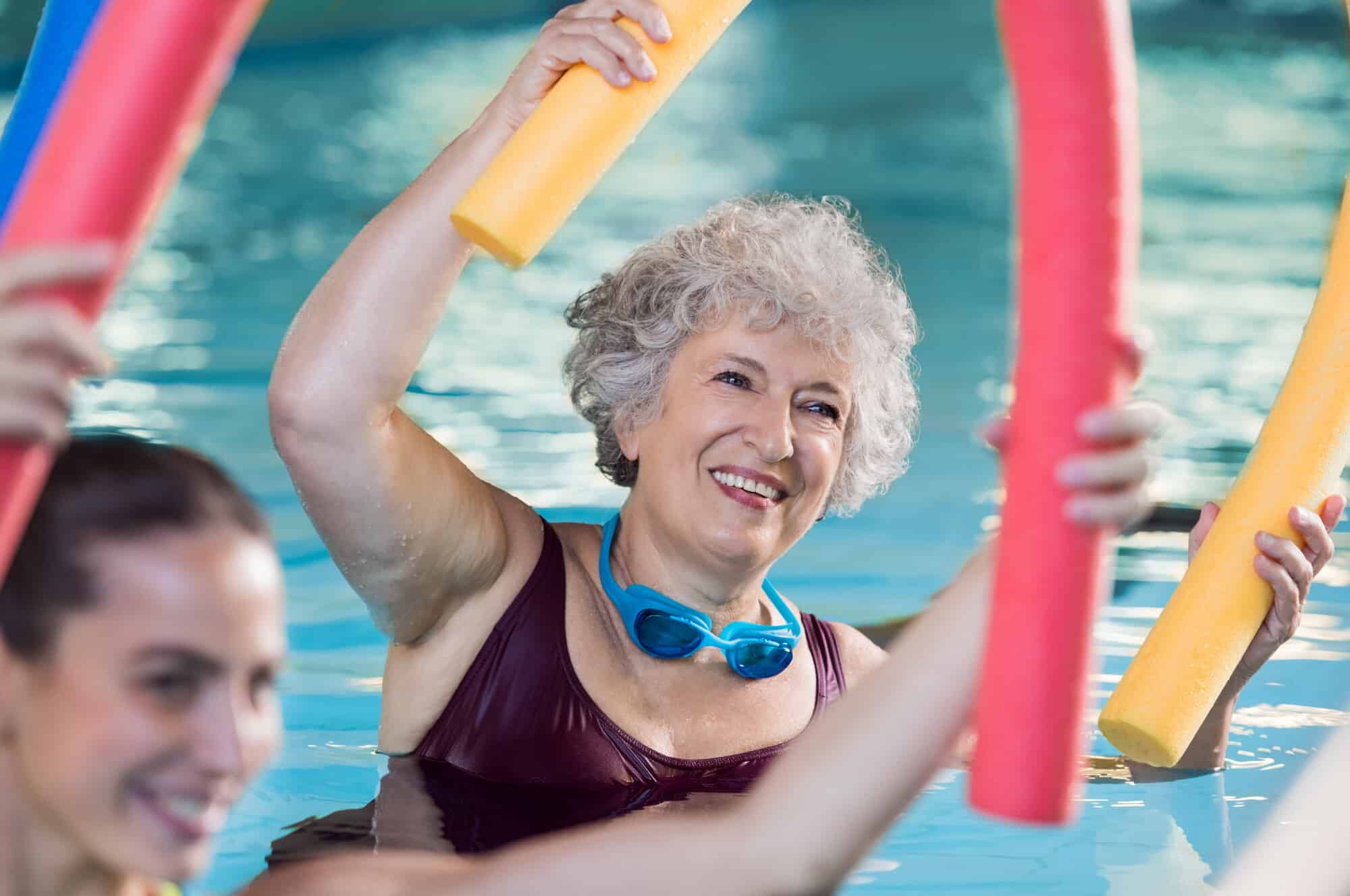 Smiling Senior Woman Doing Water Aerobics