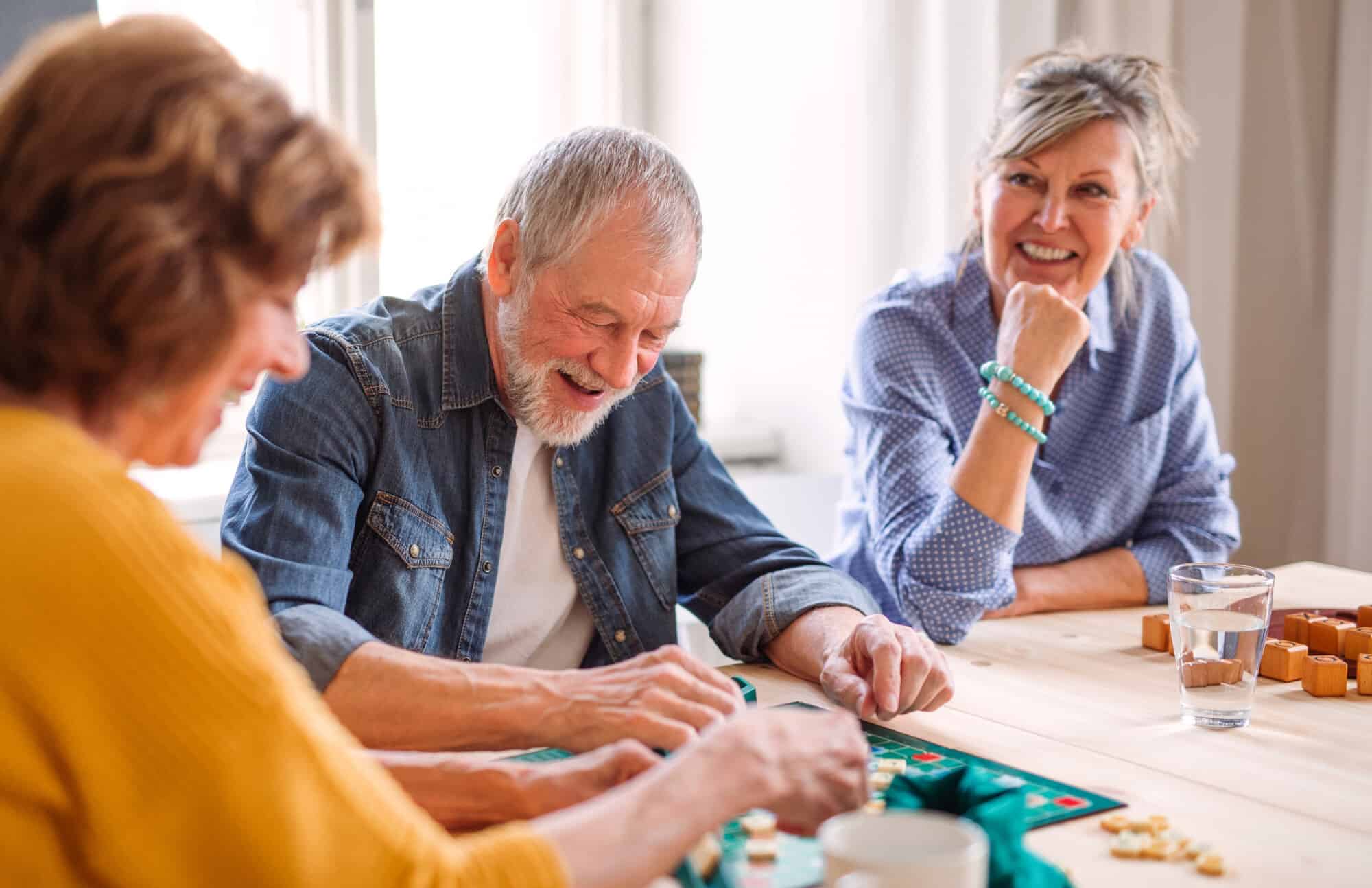 Group,Of,Senior,People,Playing,Board,Games,In,Community,Center