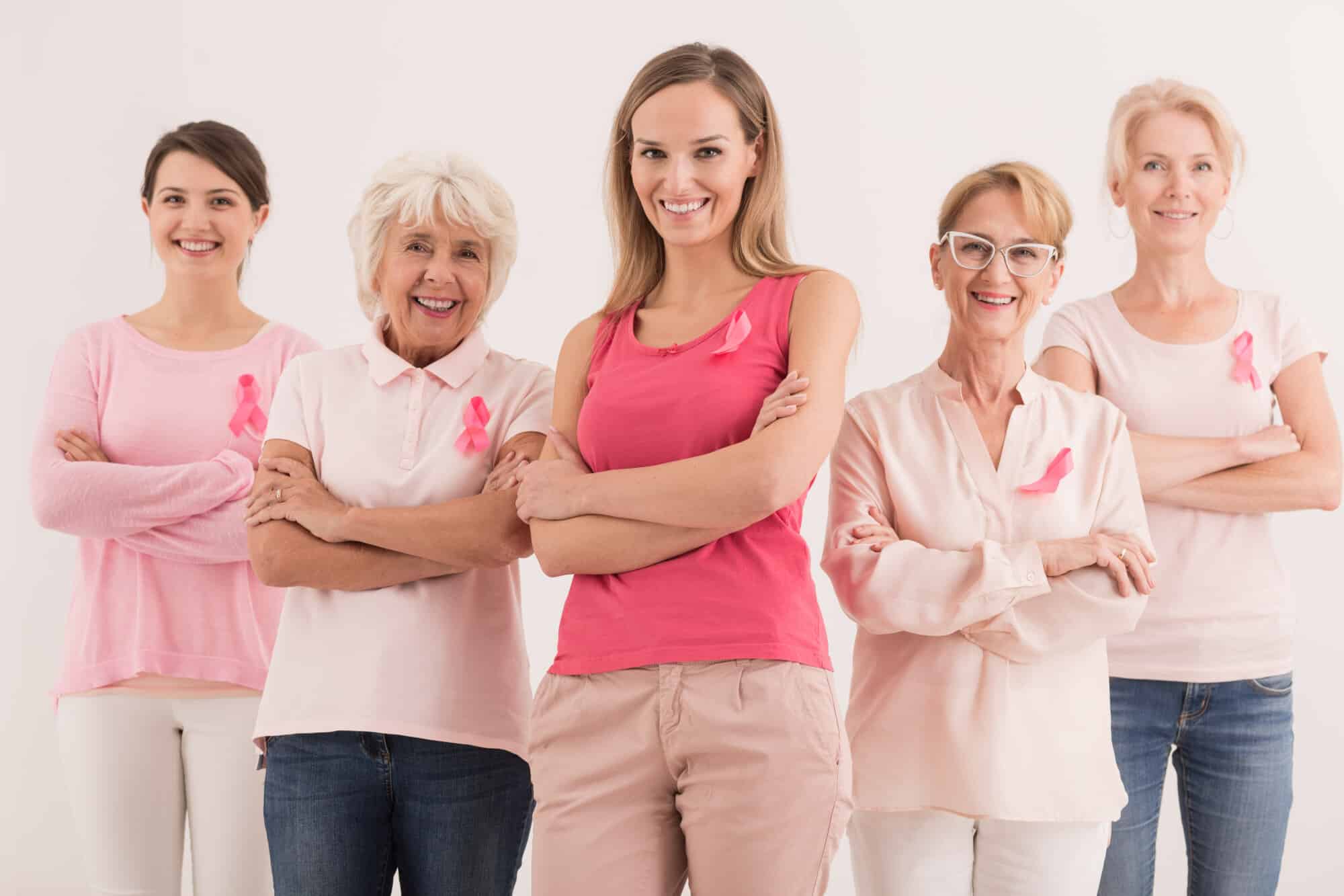 Group of Smiling Confident Women Wearing Pink
