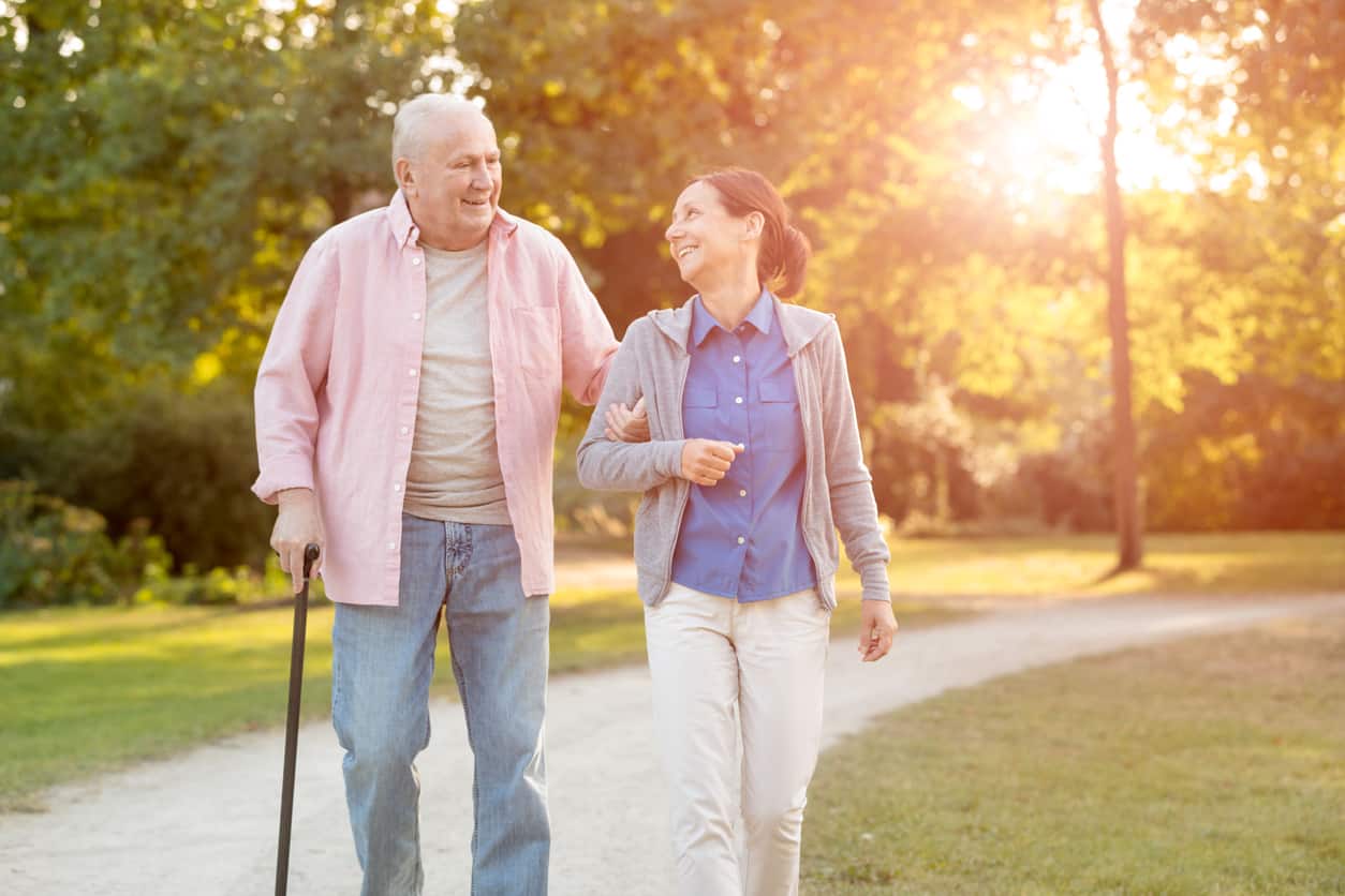 senior woman and caregiver go walking outdoors, When Should You Start to Consider Assisted Living in Royal Palm Beach?